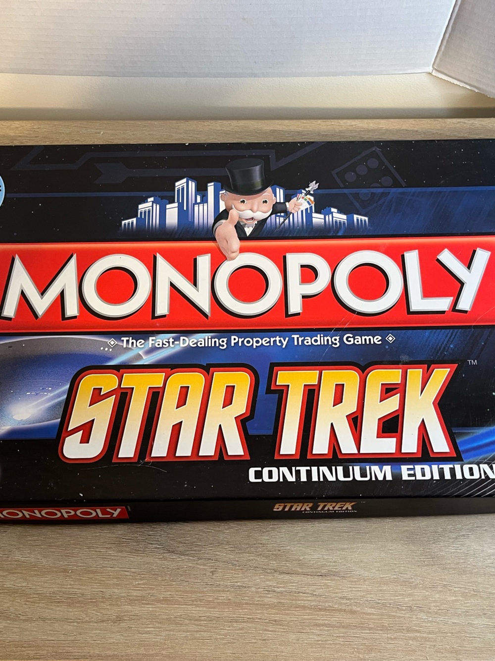 Hasbro Monopoly Star Trek Continuum Edition - Red, Blue, Black
